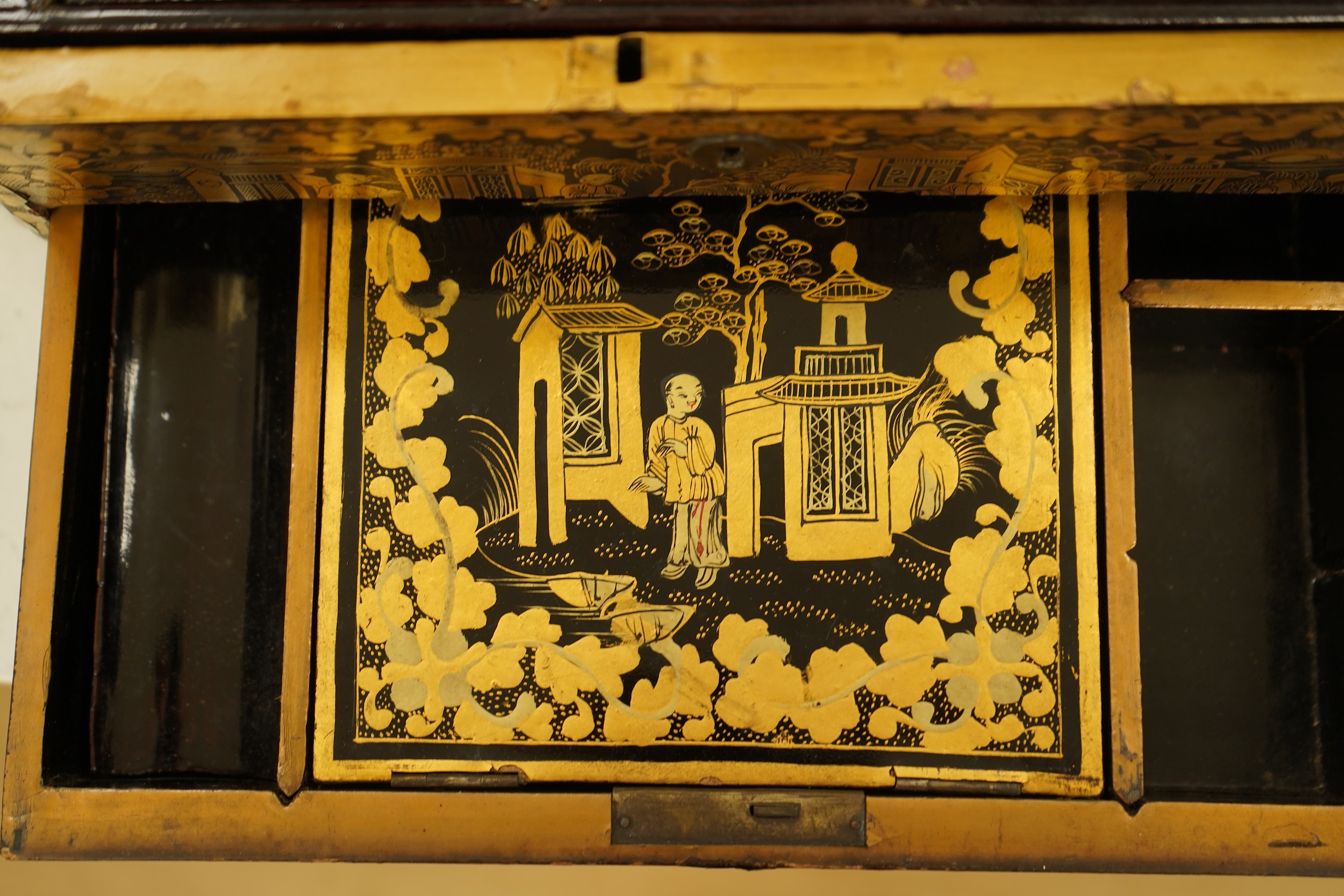 A Chinese export octagonal lacquered work box with fitted interior, 35cm wide